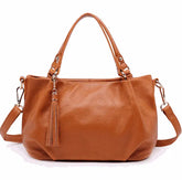 Sac bandoulière portable en cuir de vachette pour femmes avec fermeture à glissière et poche intérieure.