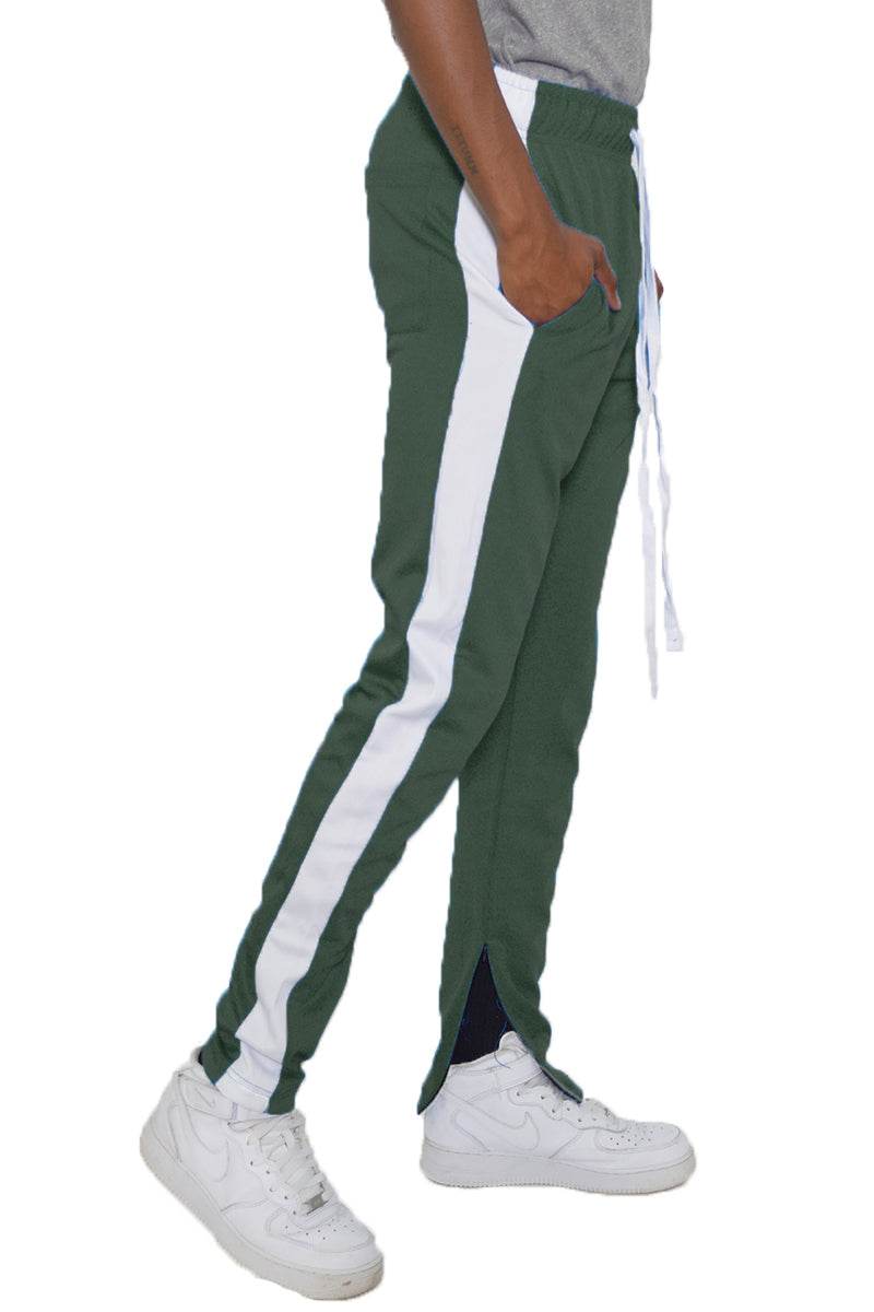 Pantalon de survêtement slim fit avec bande unique et fermeture éclair invisible aux chevilles, tissu polyester et spandex.