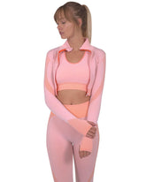Veste sport sans couture Trois rose avec motifs rayés et ruchés, fermeture zippée et col montant