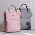 Sac à langer matelassé pour bébé avec multiples poches, tissu Oxford durable et design pratique pour déplacements parents-enfants.